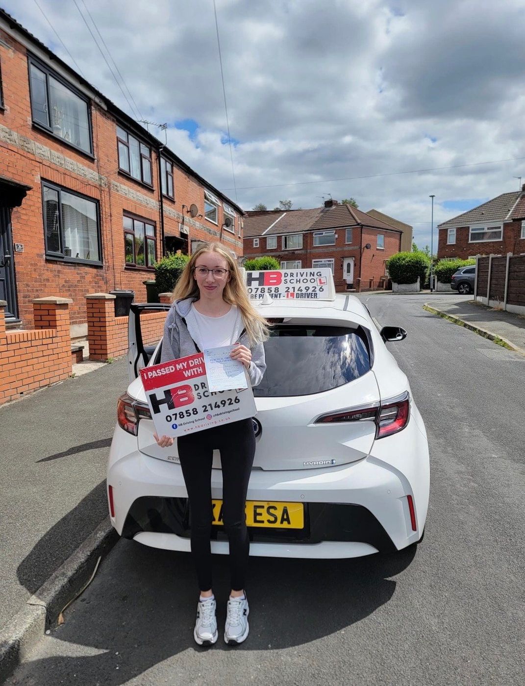 HB Driving School learner celebrating with her practical driving test pass certificate