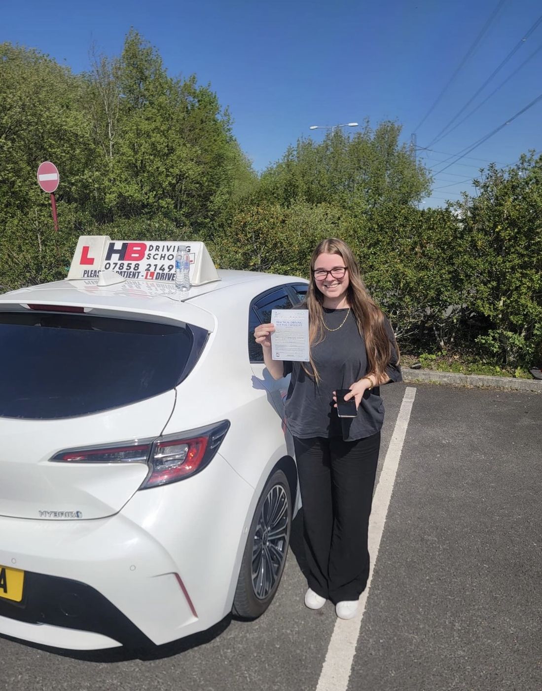 HB Driving School learner celebrating with his practical driving test pass certificate